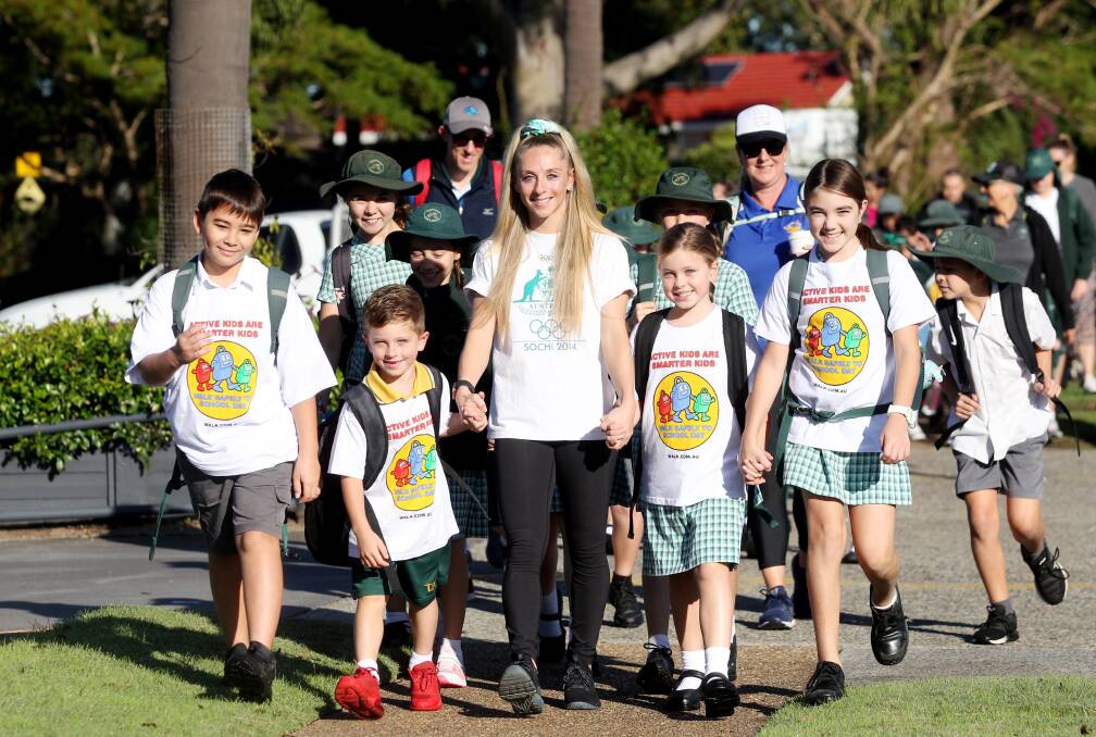 Walkers: Olympian Steph Magiros steps out with the students from Taren Point Public School. Picture: Chris Lane