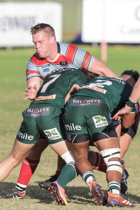 Southern Districts Rugby Club Captain Jake Douglas tries to stem the Galloping Greens attack last season. Picture John Veage