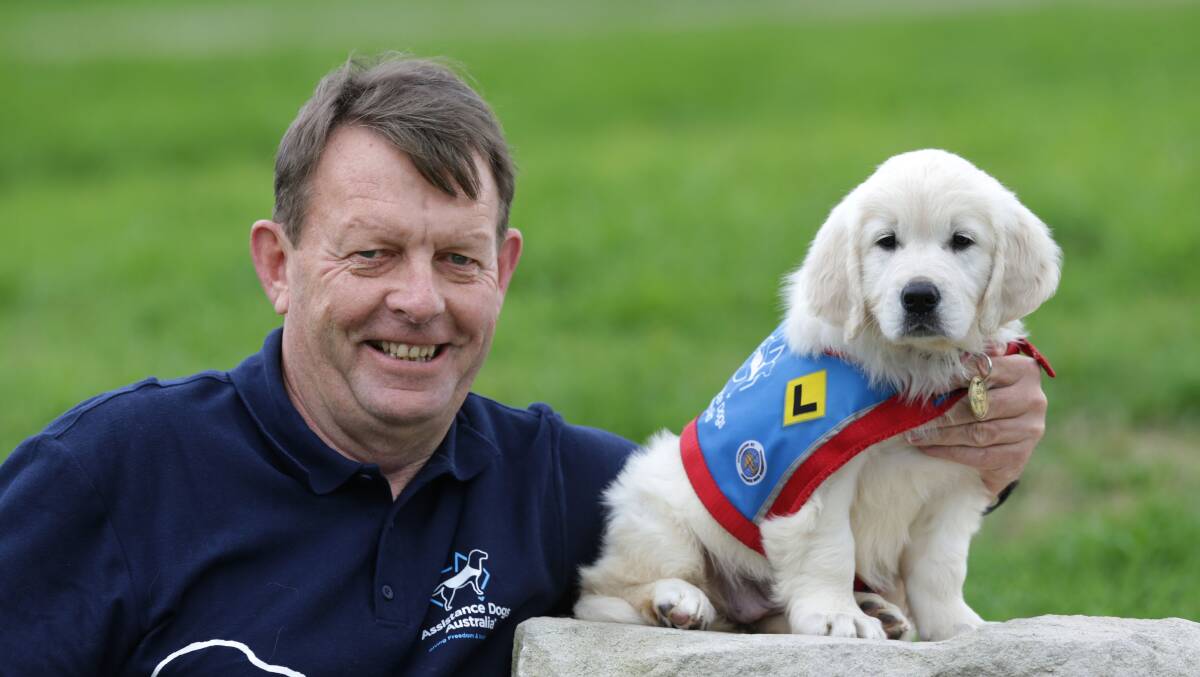 Challenge: Top Dog Richard Lord with his puppy 'Dame Quentin'. Picture John Veage