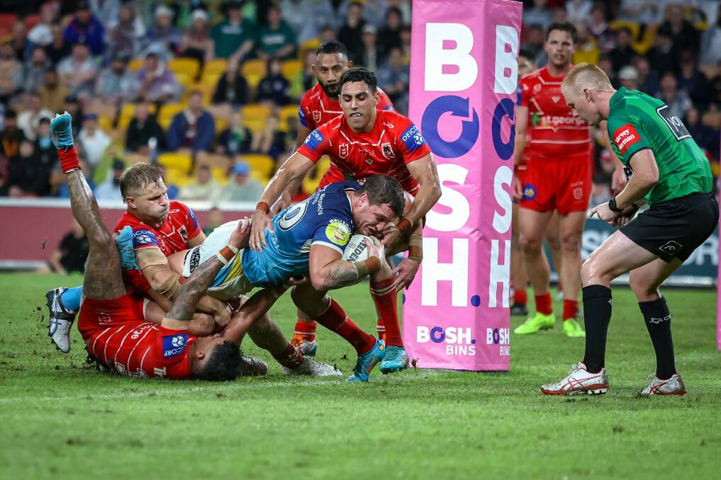 Costly loss:Titans player Jarrod Wallace scores in their Round 10 clash againt St George Illawarra in Magic Round.Picture NRL Images