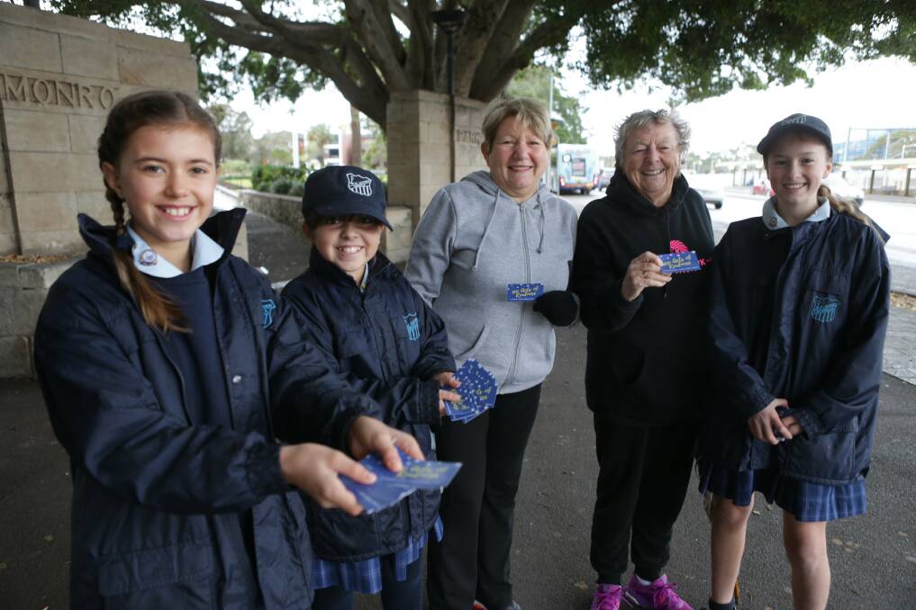 Grace: St Aloysius Cronulla pupils Amelia, Bianca and Lilly present kindness cards to Anne Shalhoub and Barbara Jones. Picture: John Veage 