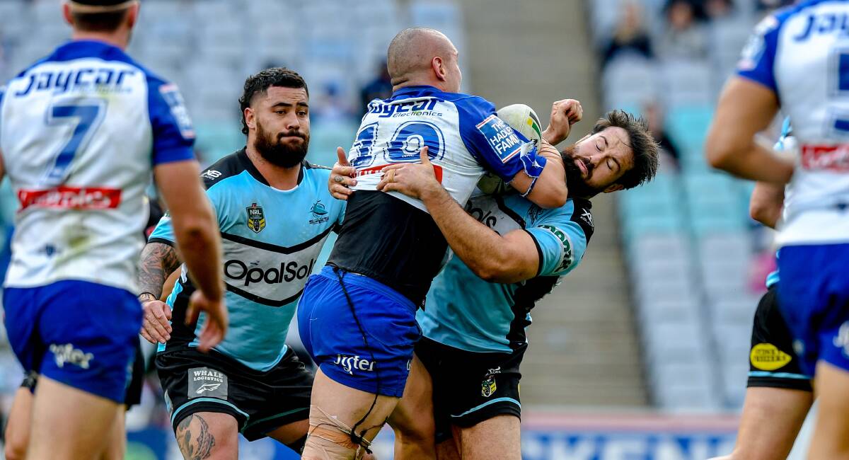 It's on: Aaron Woods and Andrew Fifita attempt to tackle David Klemmer in round 25 last season. Picture: Brendan Esposito/AAP Image