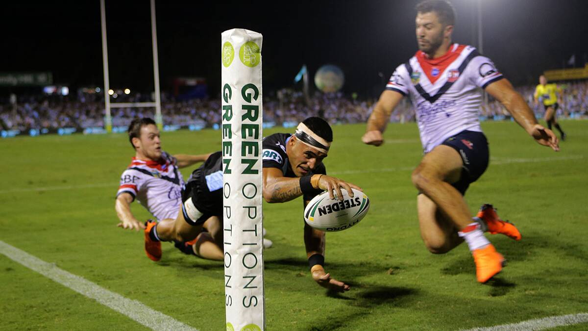 Stretching out: Valentine Holmes scored twice for Cronulla but the Sharks still went down to the Roosters. Picture: John Veage