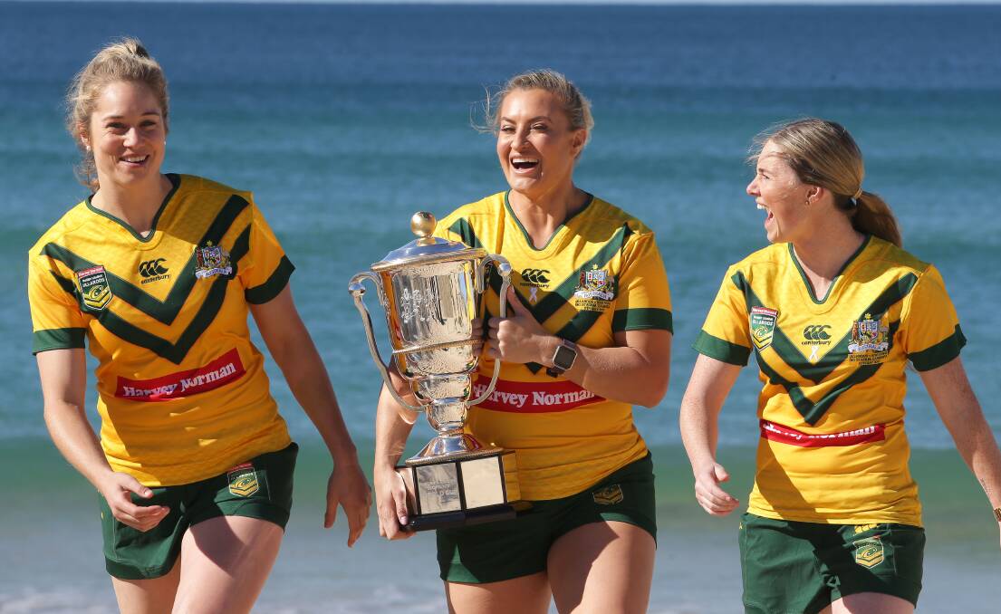 The skipper: Jillaroos captain Ruan Sims (centre) delivers the World Cup trophy to the shire with Kezie Apps and Maddie Studdon. Picture: John Veage