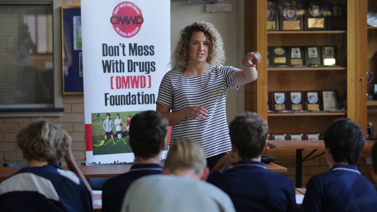 Don't Mess With Drugs Foundation educator Chloe Kerr puts shire junior footballers through the program at Kareela on Thursday. Picture: John Veage