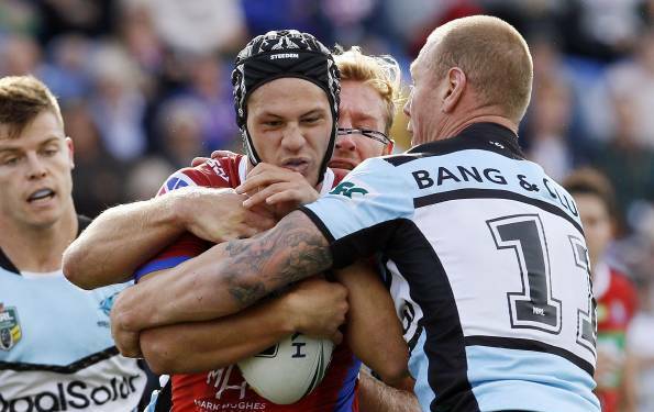 Hunted: Luke Lewis tackles Kalyn Ponga when Cronulla thrashed Newcastle in May. Picture: Darren Pateman/AAP Image