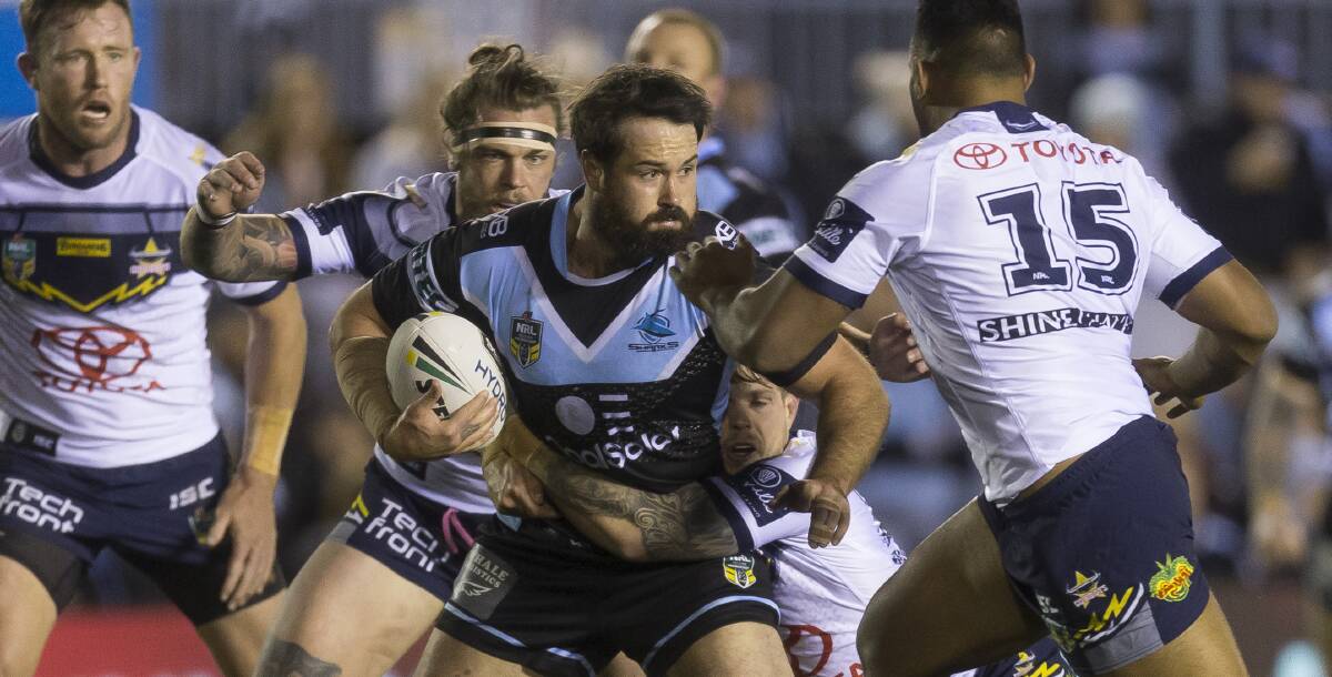 Leading from the front: Sharks prop Aaron Woods takes the ball forward. Picture: AAP Image