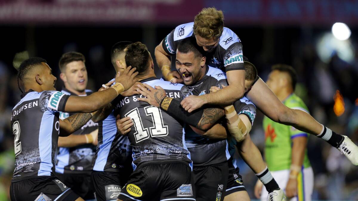 Unstoppable: Teammates congratulate Sharks prop Andrew Fifita after his barnstorming try against Canberra on Friday night. Picture: Chris Lane