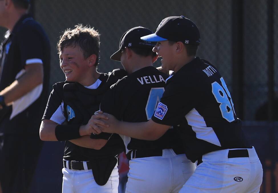 Magic: Lachlan (middle) and Sam (left) celebrate Cronulla's title. Picture: SMP Images/Baseball Australia