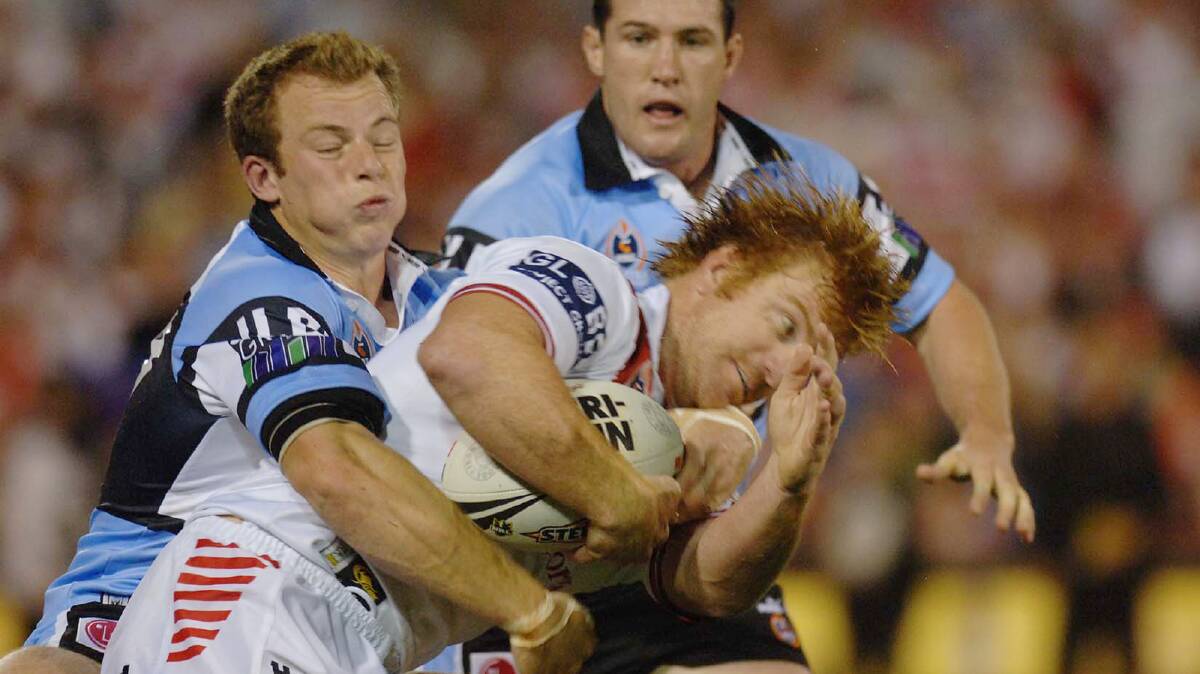 Much-loved: Former Dragons hero Lance Thompson hits the ball up against Cronulla in 2005. Picture: AAP Image