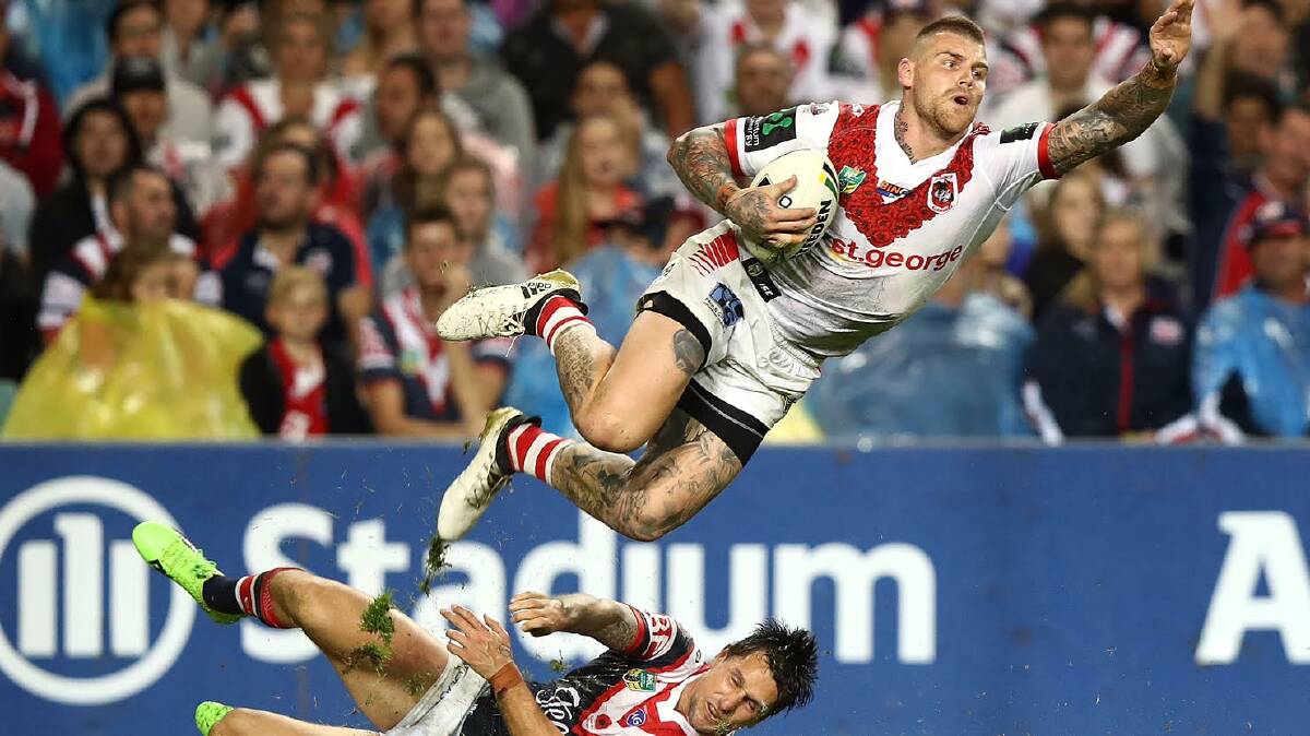 Josh Dugan is taken out by Mitchell Pearce. Picture: Getty Images