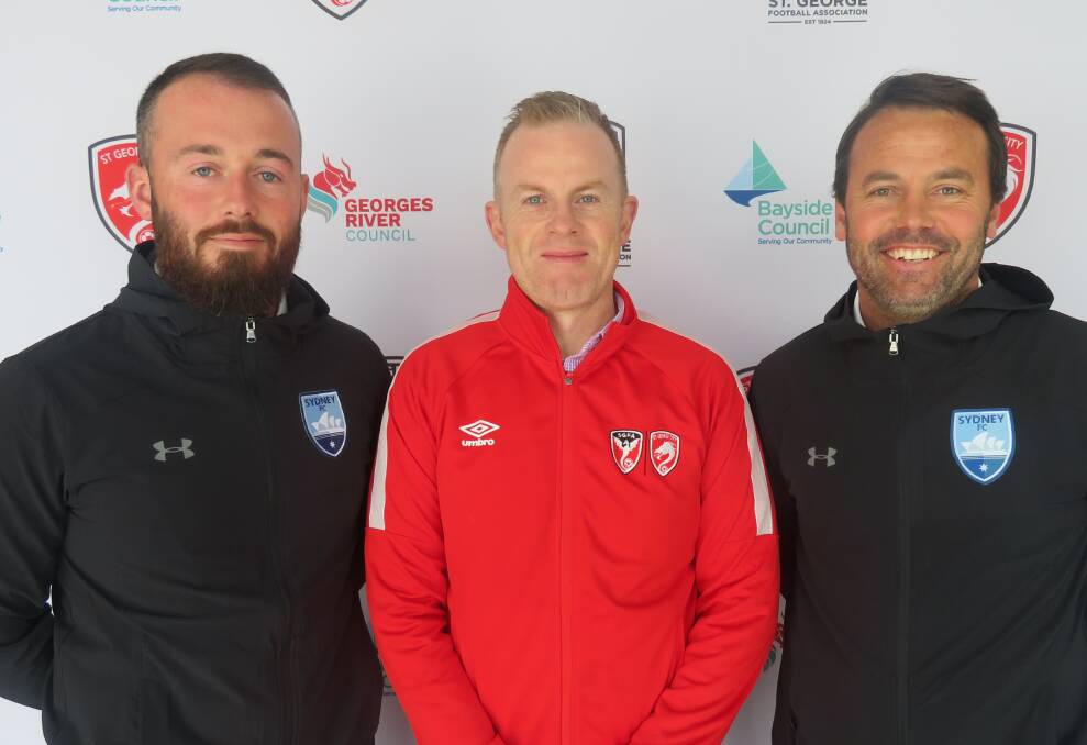 New face: Sydney FC fan development officer for St George Billy Kirk (left) with SGFA CEO Craig Kiely and Sydney FC manager of community programs Paul Reid. Picture: Supplied