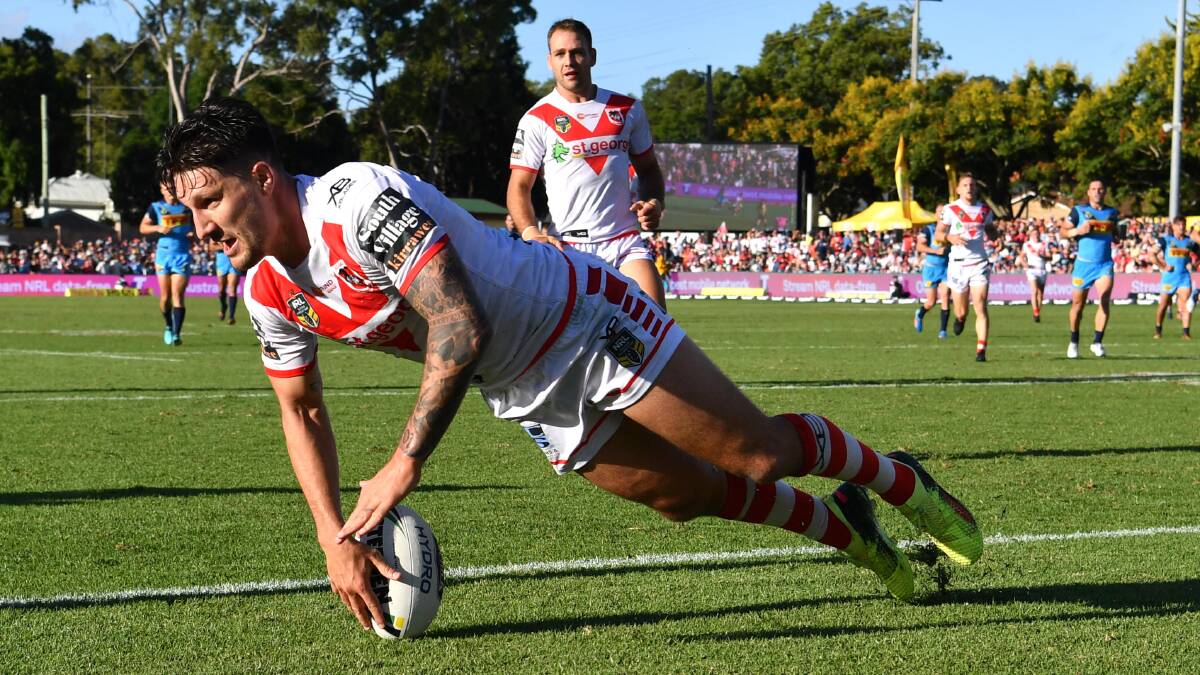 Leading the way: Dragons captain Gareth Widdop scores a try against the Gold Coast in Toowoomba on Sunday. Picture: Darren England/AAP Image