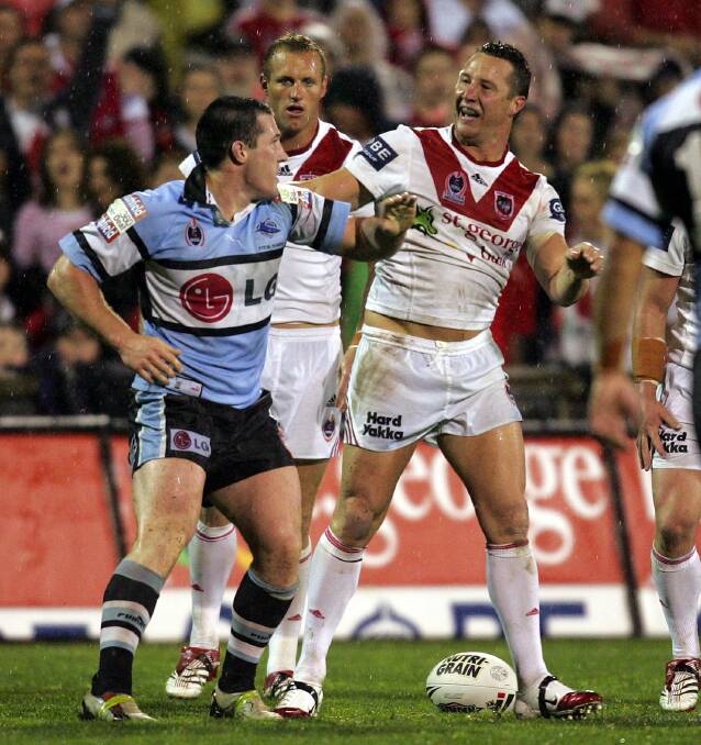 It's on: Sharks captain Paul Gallen and current Dragons pathways recruitment manager Shaun Timmins square up in a heated derby in 2006. Picture: Andy Zakeli