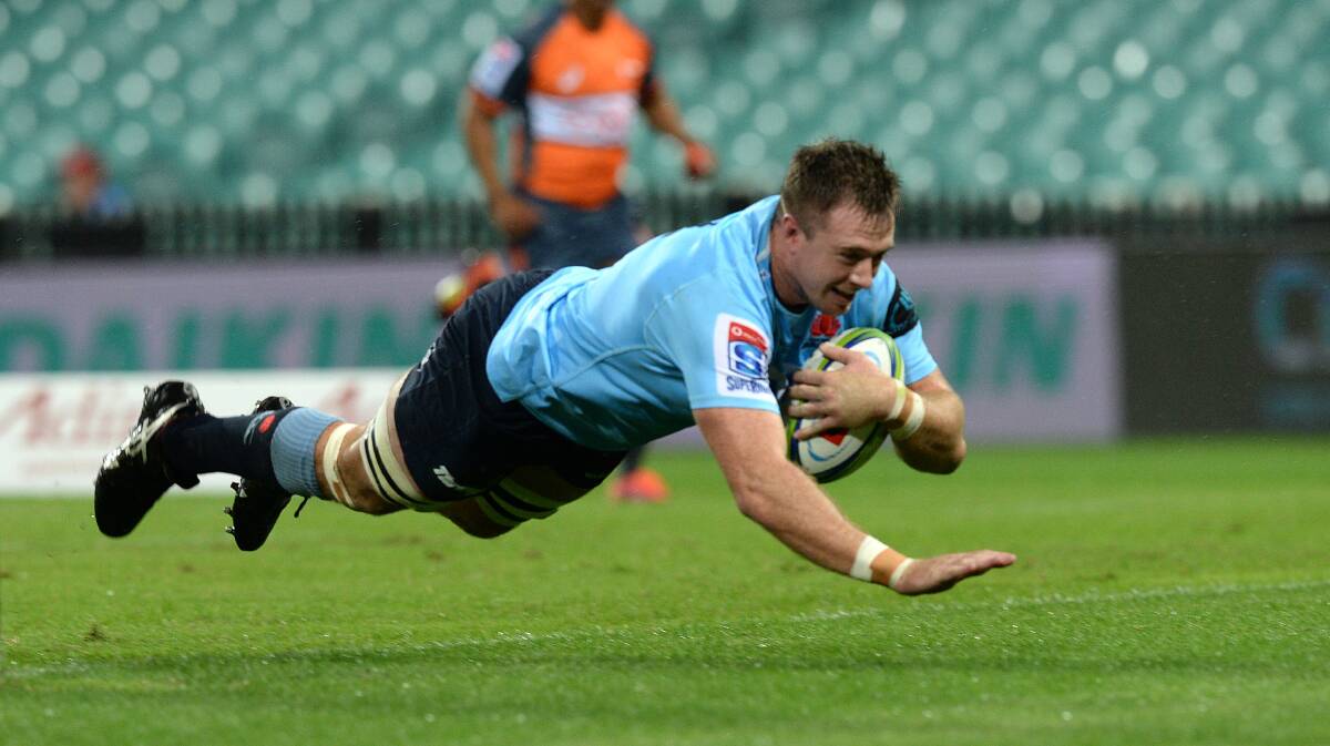Try time: Southern Districts star Jed Holloway scores a try for the Waratahs against Canterbury in round six of the Super Rugby season. Picture: Jeremy Piper/AAP Image
