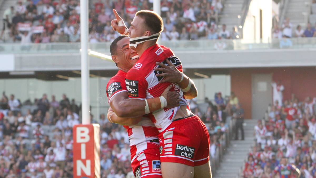 Try time: Tyson Frizell congratulates Euan Aitken on his try as the Dragons downed Newcastle by 18 points in Wollongong on Sunday. Picture: Adam McLean