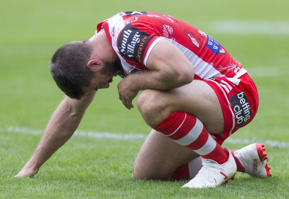 Ouch: Dragons halfback Ben Hunt battled on with a badly corked leg in his side's loss to South Sydney on Sunday. Picture: AAP Images