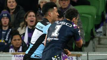 That tackle: Billy Slater is penalised for a shoulder charge on Sosaia Feki. Picture: AAP Image