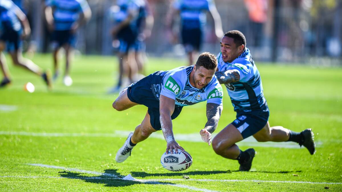 Tariq Sims takes on Dragons teammate Tyson Frizell at NSW training. Picture: AAP Image