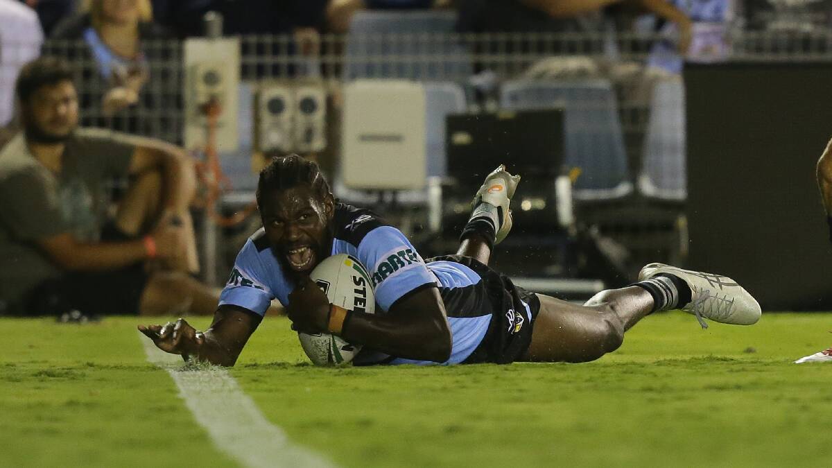 Match winner: Edrick Lee crosses for the only try of the match for Cronulla. Picture: Chris Lane