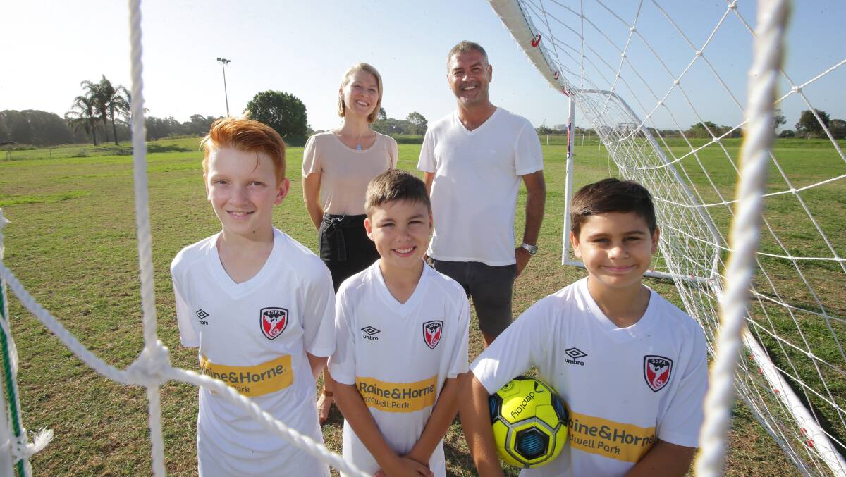 Good cause: St George juniors (from left) Jay, Marco and Adam with Mariana and Mark Rudan supporting Kick it for Brain Cancer. Picture: John Veage