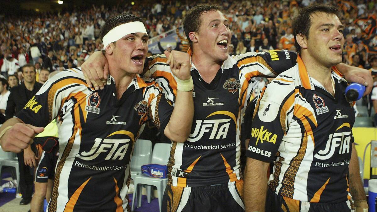 Fresh face: Chris Heighington (left) with Tigers teammates Bryce Gibbs and John Skandalis in 2005. Picture: Mark Nolan/Getty Images