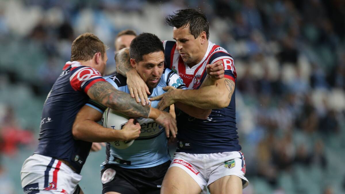 New colours: Mitchell Pearce (right) has spoken to Cronulla officials about joining the club next season. Picture: John Veage