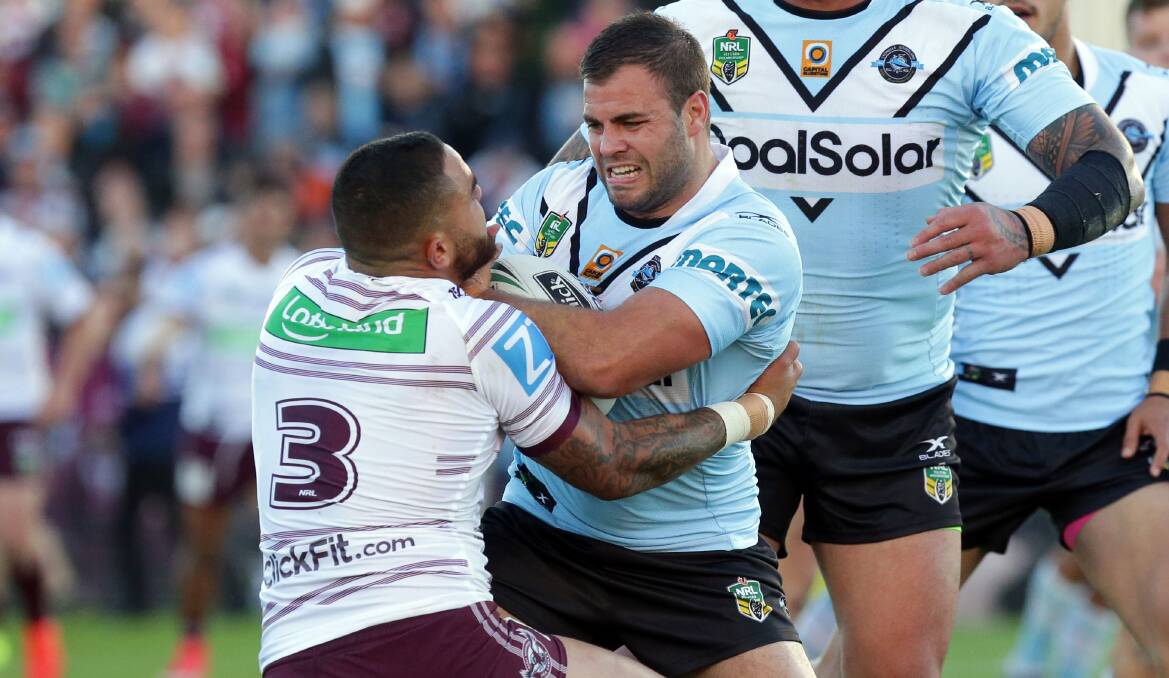 Sharks co-captain Wade Graham tries to shake off Manly's Dylan Walker. Picture: Chris Lane