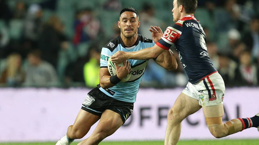 Star man: Valentine Holmes runs the ball against the Roosters on Saturday night. Picture: John Veage