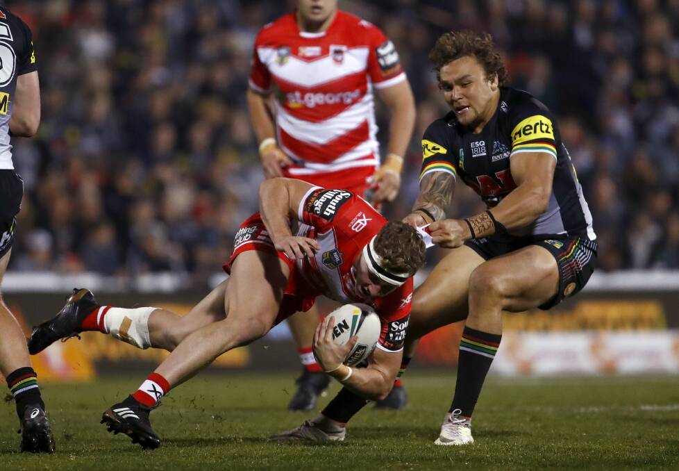 Stopped: Dragons utility Kurt Mann is tackled by Penrith's James Fisher-Harris during St George Illawarra's 26-point defeat. Picture: AAP Images