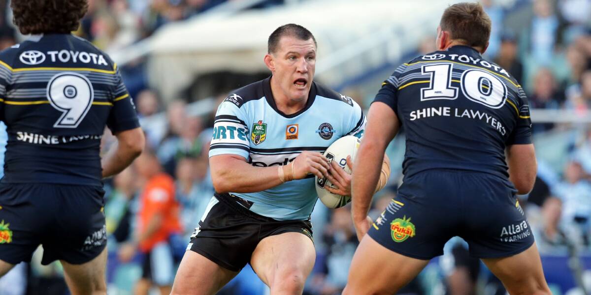All over: Sharks captain Paul Gallen hits the ball up against the Cowboys. Picture: Chris Lane