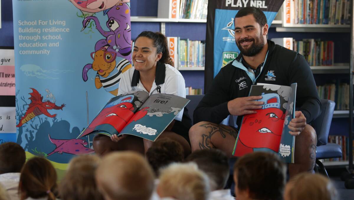 Resilient: Sharks prop Andrew Fifita with Cronulla women's star Shontelle Stowers at Kurnell Public School. Picture: John Veage