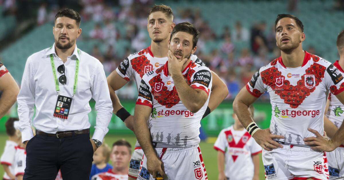 Dejected: Gareth Widdop, Ben Hunt and Corey Norman look on after the Dragons' 20-10 loss to the Roosters on ANZAC Day. Picture: AAP Image