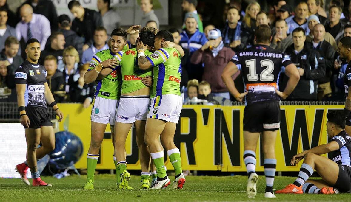 Try time: Canberra celebrate a Jordan Rapana try in their win over Cronulla on Saturday night. Picture: John Veage