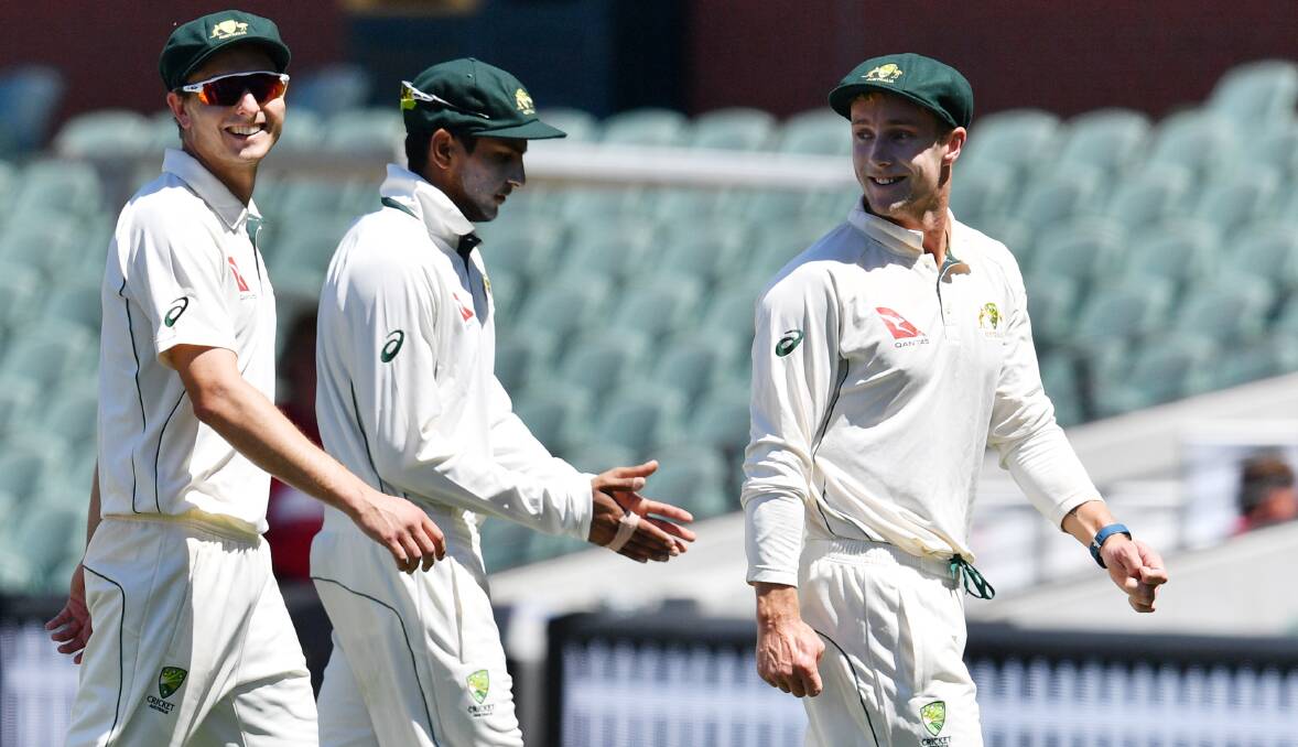 Proud moment: Sutherland's Daniel Fallins (right) leads the Cricket Australia XI off the Adelaide Oval after his five-wicket haul. Picture: AAP