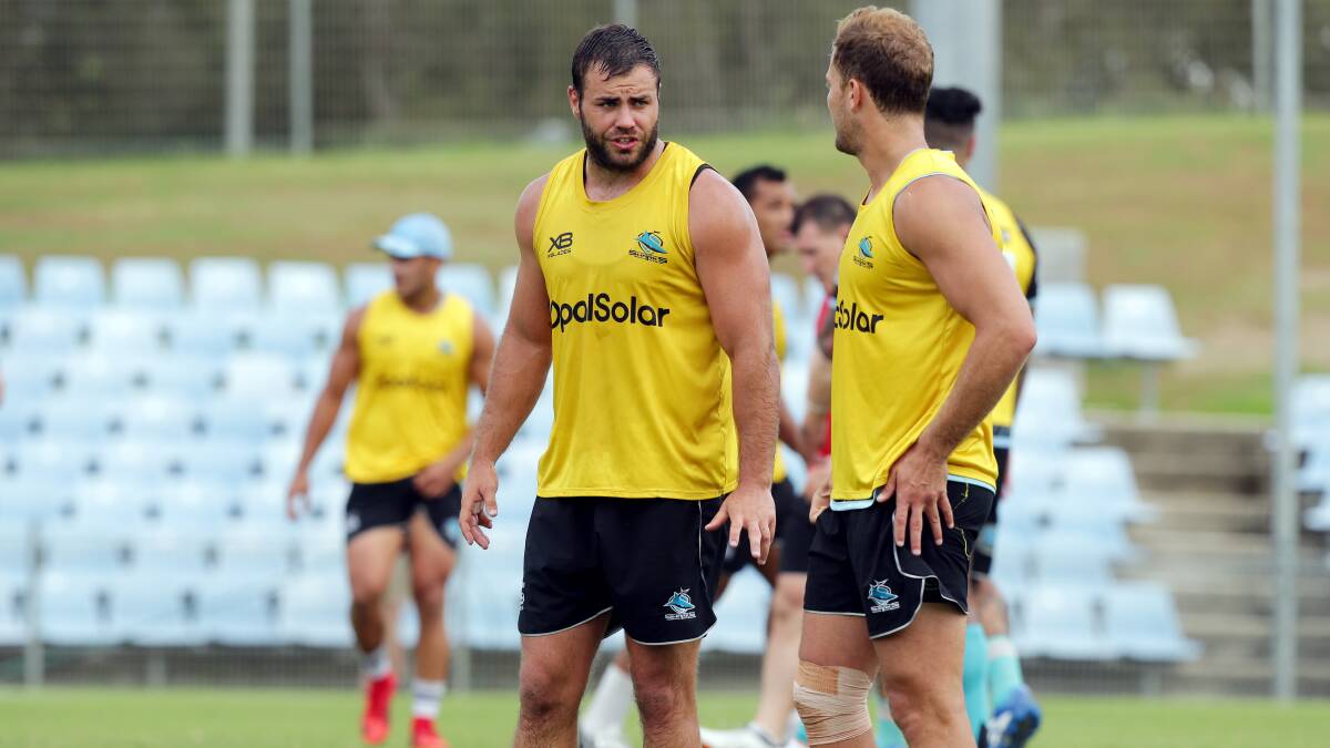 Wade Graham in discussion with Matt Moylan at Sharks training. Picture: Chris Lane