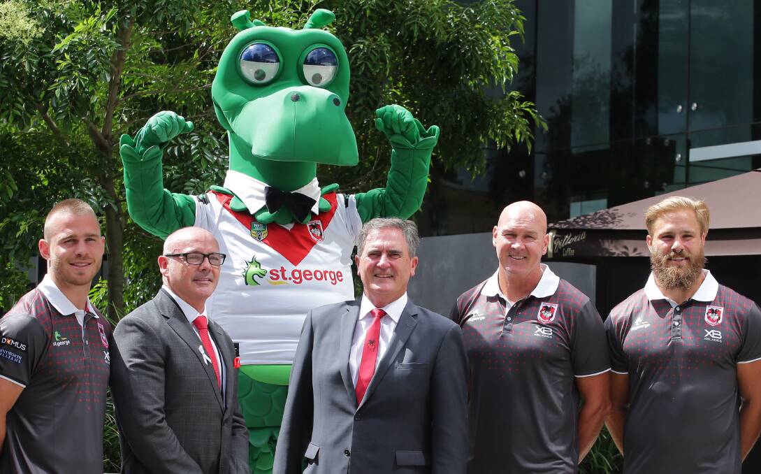 Leaving: St George Illawarra Dragons CEO Peter Doust [centre] at St George Bank's Kogarah branch in late 2017. Picture: John Veage