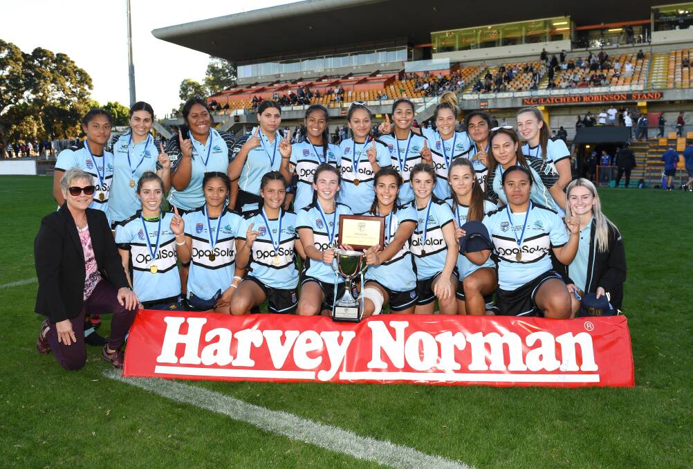 Champions: The Cronulla Sharks players celebrate their Tarsha Gale Cup grand final win over Newcastle at Leichhardt Oval on Saturday. Picture: Cronulla Sharks