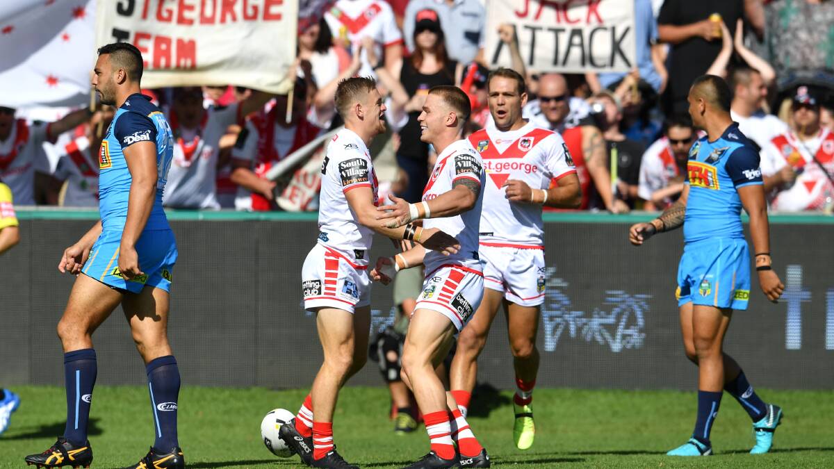 Try time: Matt Dufty scored a hat-trick for the Dragons against the Titans. Picture: AAP Image