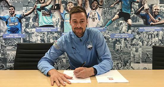 Jacob Tratt signs his short-term contract with Sydney FC. Picture: Sydney FC