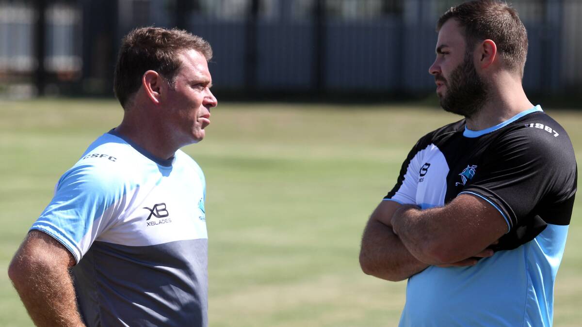 Wade Graham and Brett Kimmorley chat at Sharks training on Tuesday. Picture: Chris Lane