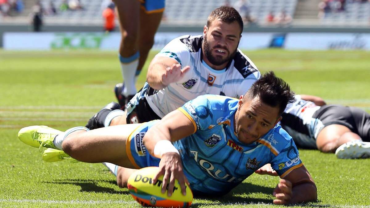 Back again: Sharks co-captain Wade Graham fails to stop the Titans from scoring at the 2017 Auckland Nines. Picture: NRL Photos
