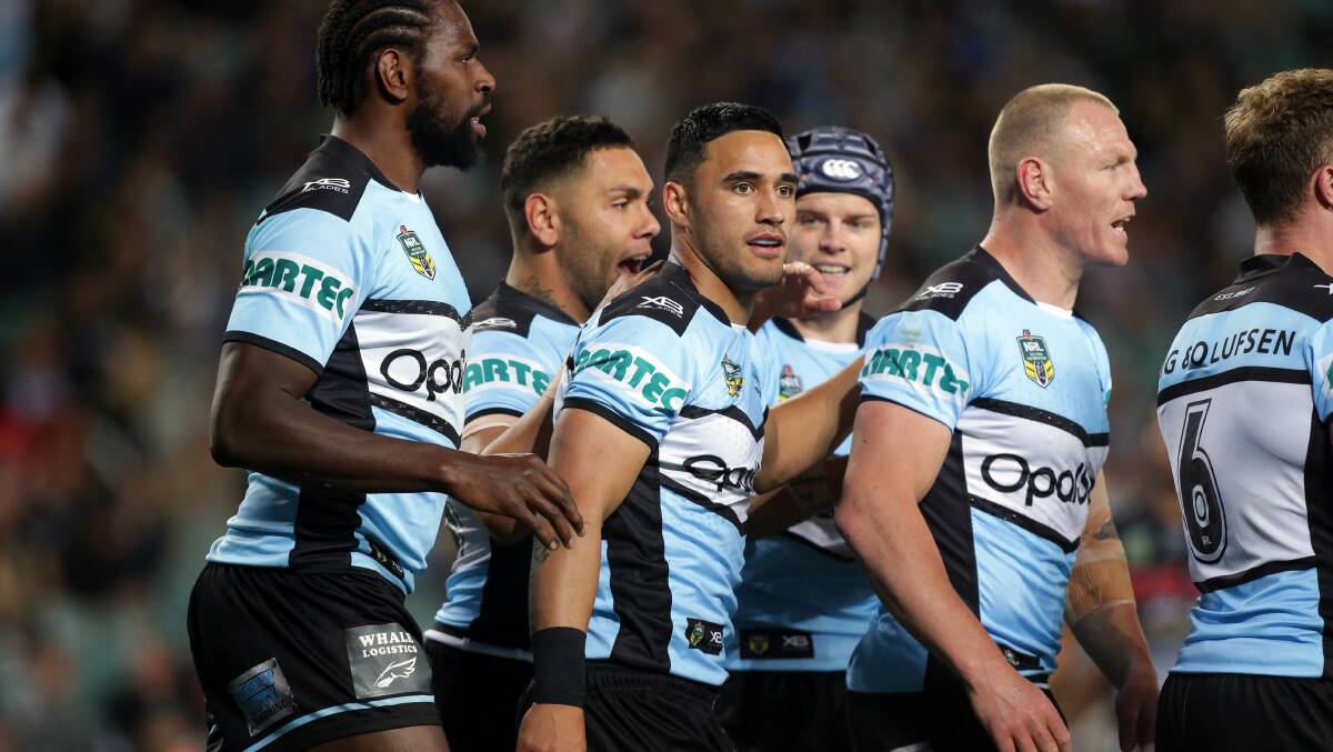 Star man: Valentine Holmes celebrates his try against the Panthers. Picture: Chris Lane