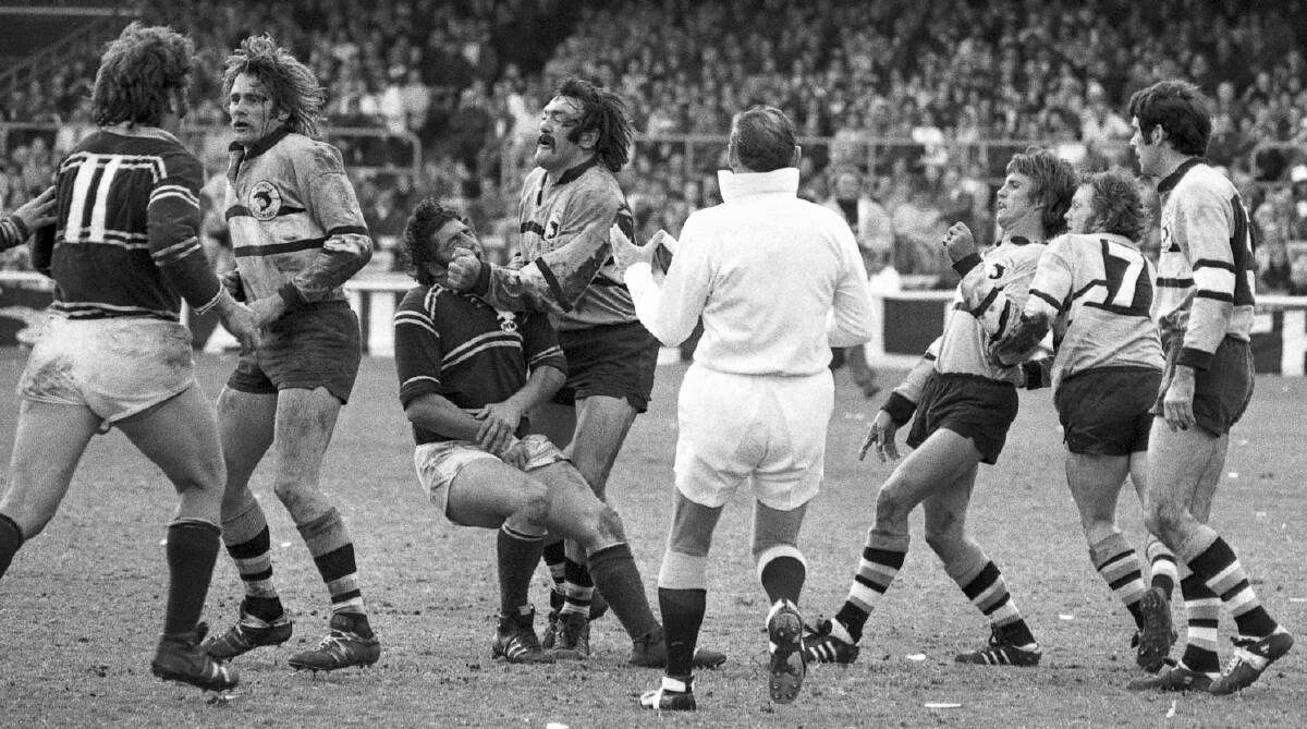 Enforcer: Cliff Watson (centre) tackles Manly's Peter Peters in the opening minutes of the 1973 grand final at the SCG. Picture: O'Gready/Purcell/Pearce/Fairfax Photos