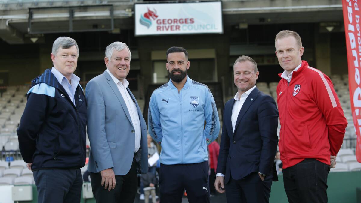Strong at home: Sydney FC captain Alex Brosque and CEO Danny Townsend with Georges River Council mayor Kevin Greene, SGFA general manager Craig Kiely and SSFA general manager Jeff Stewart. Picture: John Veage