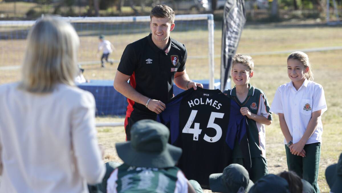 All smiles: Bournemouth goalkeeper Jordan Holmes meets the students at Sylvania Heights Public School on Wednesday. Picture: John Veage