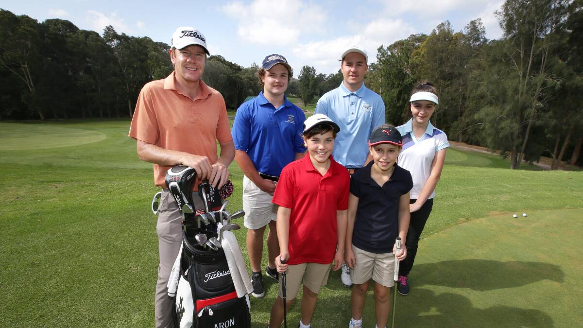 In the swing: Professional golfer Aron Price (left) held his seventh annual junior open at Kareela Golf Club late last month. Picture: John Veage 