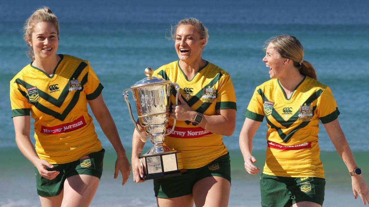 Jillaroos Kezie Apps, Ruan Sims and Maddie Studdon deliver the women's rugby league World Cup trophy to the shire. Picture: John Veage