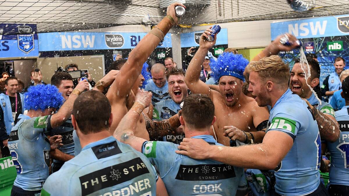 Celebration: (From right) Paul Vaughan, Matt Prior and Jack de Belin celebrate with their NSW teammates after Origin II. Picture: AAP Image