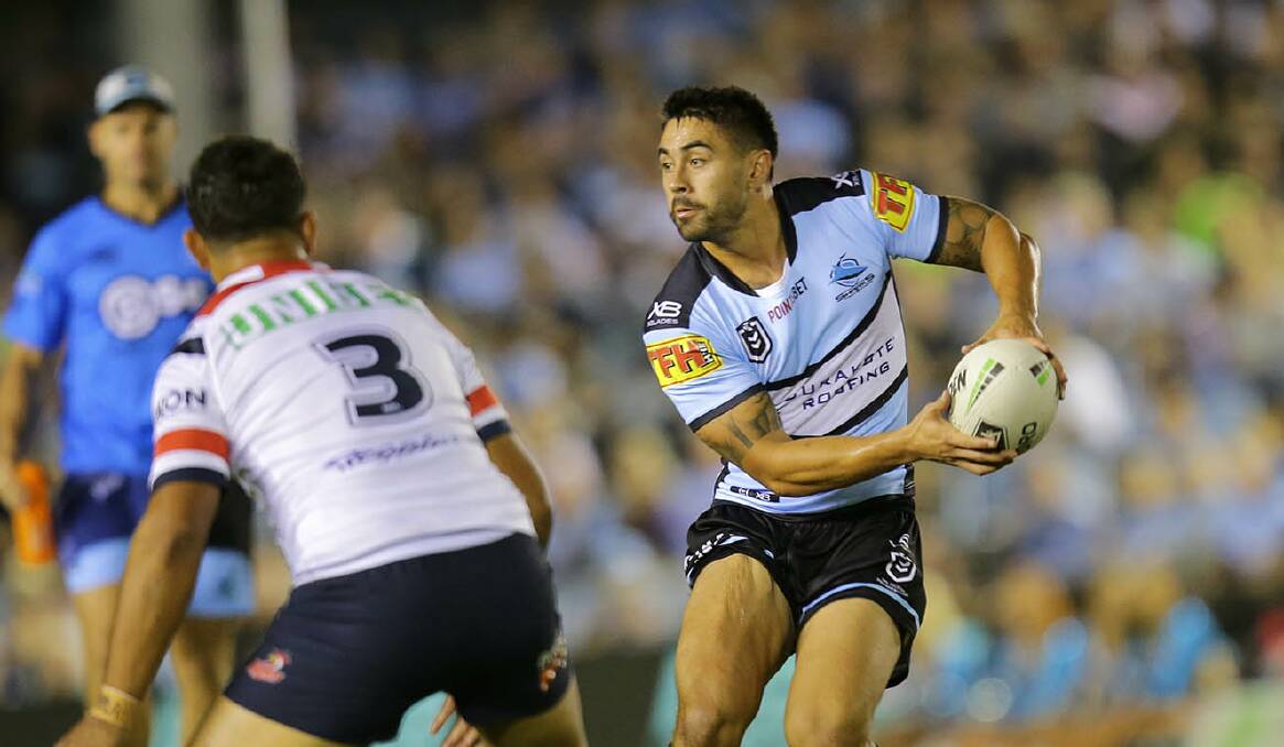 Tough night: Shaun Johnson tries to spark the Sharks against the Roosters. Picture: John Veage